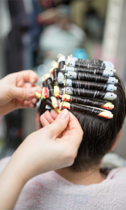 hair curlers applied on a person’s head