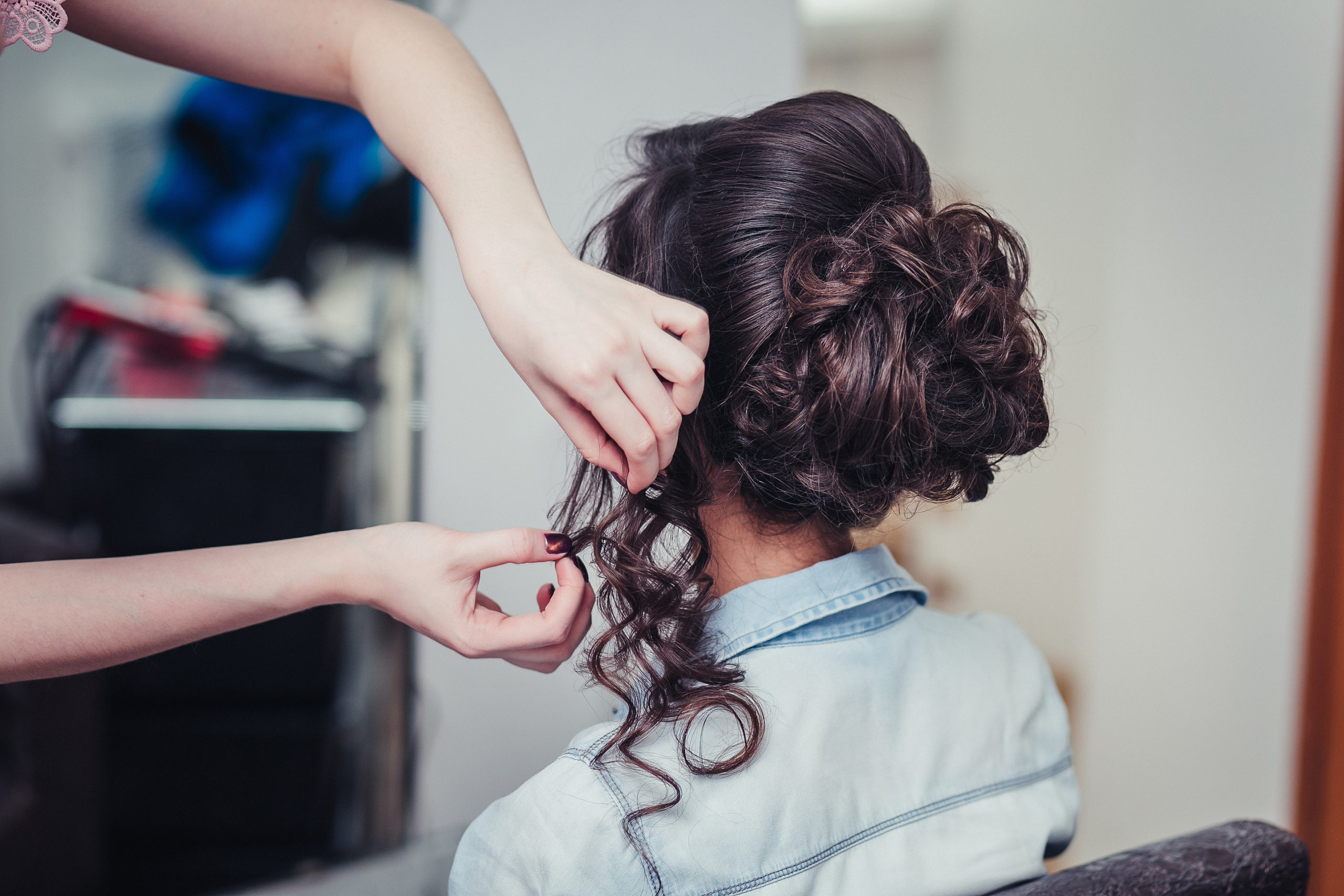a person getting their hair styled